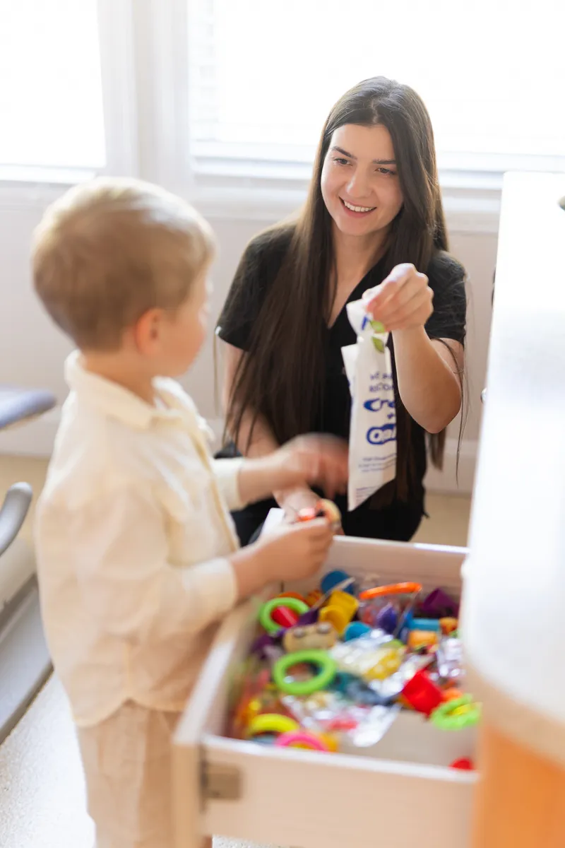 A child playing at the toy table at Darien Pediatric Dentistry