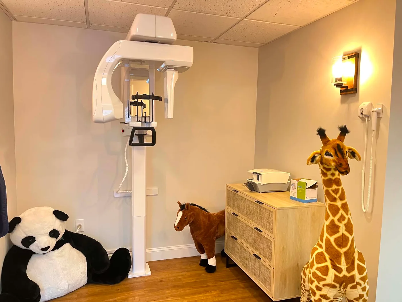 Imaging room with the panoramic X-ray machine and friendly plush animals