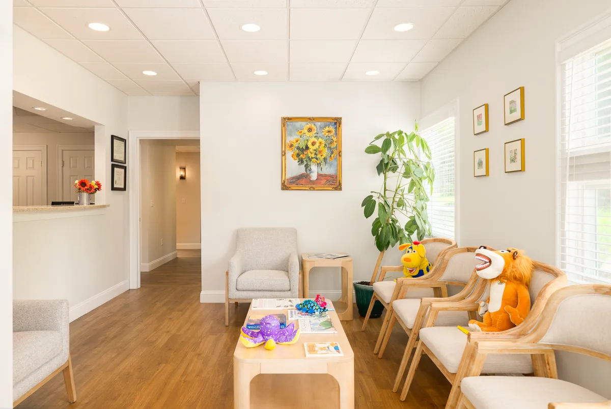 The Darien Pediatric Dentistry waiting room with kid-friendly chairs and plush toys