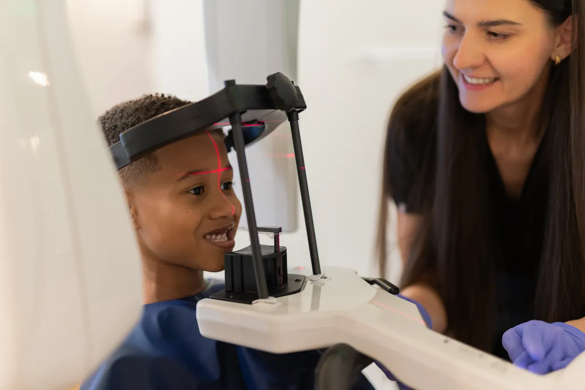 A child receiving a panoramic dental X-ray